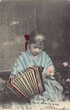 Japan - Geisha playing the accordion