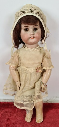 Poupee tête porcelaine - poupee.,