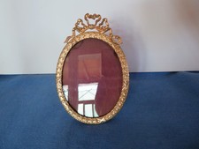 ancien cadre photo ovale en bronze et laiton surmonté d'un nœud
