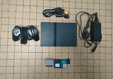 PS2 Slim + 5 Jeux + Accessoires