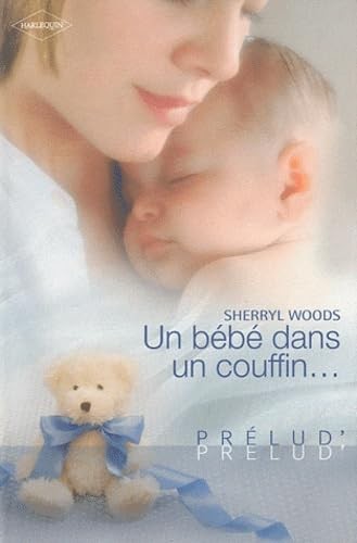 Bébé dans couffin - un,