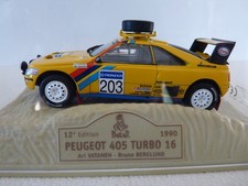 PEUGEOT 405 TURBO 16  N° 203 gagnante du DAKAR 1990 de marque NOREV au 1/43