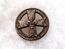 Un insigne de béret  "