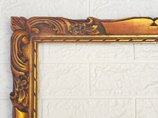 Grand cadre ancien en bois sculpté patine dorée lumineuse 58cmx68cm