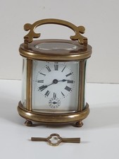 Pendule de voyage Ovale à réveil.  - Pendule d'officier ovale à sonnerie.