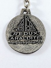 PORTE-CLÉS - SEB REDUX ARALDITE - Colles & Produits Chimiques - Métal 1960s -