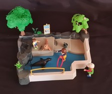 Lot Playmobil bassin phoques : personnages, animaux, accessoires.