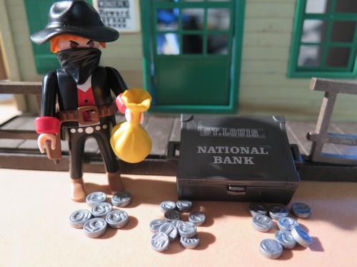 Bandit masqué caisse monnaie