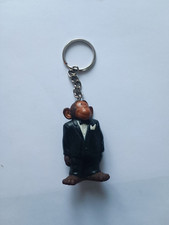 Porte-clés Figurine Singe en costume Publicité Lessive OMO Keychain vintage