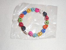 Neuf bracelet perles tête de