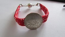 Bracelet, monté d'une monnaie