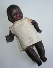 Poupon ancien noir en terre de