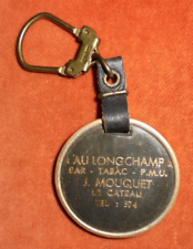 Porte-clés Tête CHEVAL Dorée AU LONGCHAMP Bar Tabac PMU J MOUQUET LE CATEAU 59 ?
