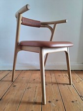 Fauteuil de table Fermyo AMPM chêne et cuir, siège design 