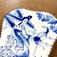 Miroir ancien en porcelaine et