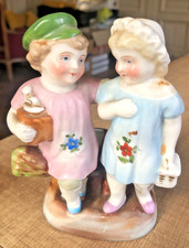 Ancien pyrogène en porcelaine polychrome à décor d'un couple d'enfants H : 14 cm