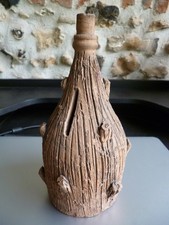 ANCIENNE TIRELIRE à CASSER forme de bouteille