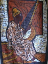 Batik africain représentant un personnage jouant d'un instrument de musique
