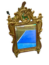 Miroir en bois sculpté doré