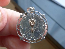 Médaille religieuse en argent et or