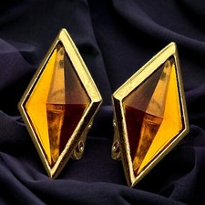 Boucles d'oreilles vintage en résine couleur ambre signées Yves Saint Laurent