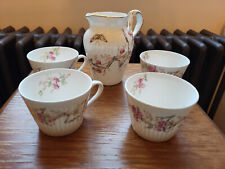 Ensemble de 4 tasses thé café et un petit pot à lait vintage en porcelaine