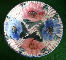 Coupe à fruits ancienne en faïence d'un diamètre de 31 cm en bon état.