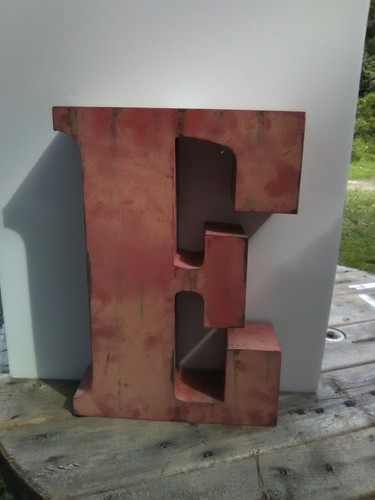 Red metal letter the - letter, e
