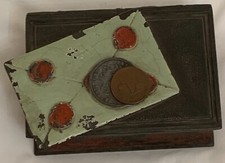 Rare antique lidded box in book form with a sealed letter and two coins on it.  