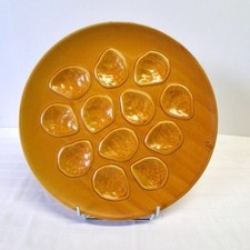 Plat de service à huîtres en céramique marron en bon état.