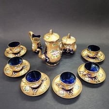 Murano, service à café de couleur bleu nuit, fond doré décor de fleurs, 9 pièces