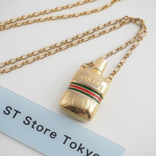 Collier bouteille parfum - de,
