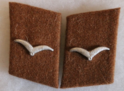 Patte col flieger - de,