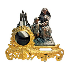 ancienne pendule en régule avec statue religieuse