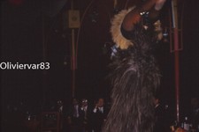 Vintage photo slide 1960s - men watching a woman pole dance in a club