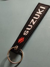 SUZUKI porte clé MOTO  SUZUKI logo double face!
