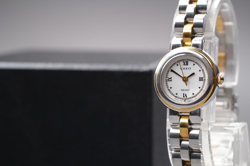 Montre femme ronde - , bicolore