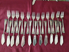 12 couteaux + 12 fourchettes à poisson métal argenté le mondial modèle coquille