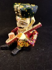 Wooden figurine Man playing