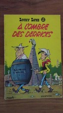 LUCKY LUKE A L'OMBRE DES DERRICKS DOS JAUNE 1964 TTBE