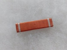 Une barrette de médaille de l'Ordre Ouissam Alaouite.