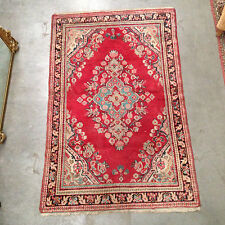 tapis d'orient  model aux quatre coins , motif central floral . XX siècle .