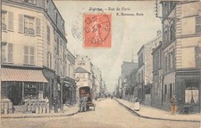 CPA 92 PUTEAUX / LA RUE DE PARIS