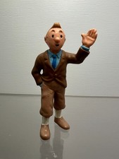 Figurine tintin main en l'air