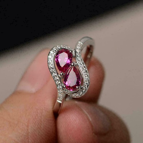 Bague tourbillon deux pierres