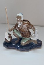 statuette pécheur en