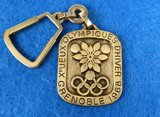 Porte-clés Logo - X° JEUX OLYMPIQUES D'HIVER 1968 - GRENOBLE - d'après EXCOFFON