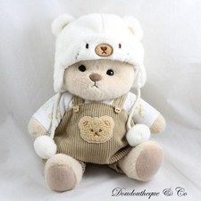 Peluche articulée ours GETAHUG salopette ourson marron bonnet blanc Get a Hug
