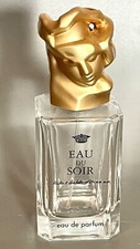 Flacon de parfum Eau Du Soir de Sisley vide bouchon en forme de visage doré