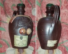 Ancienne bouteille en grès vieux Calvados décoration en relief